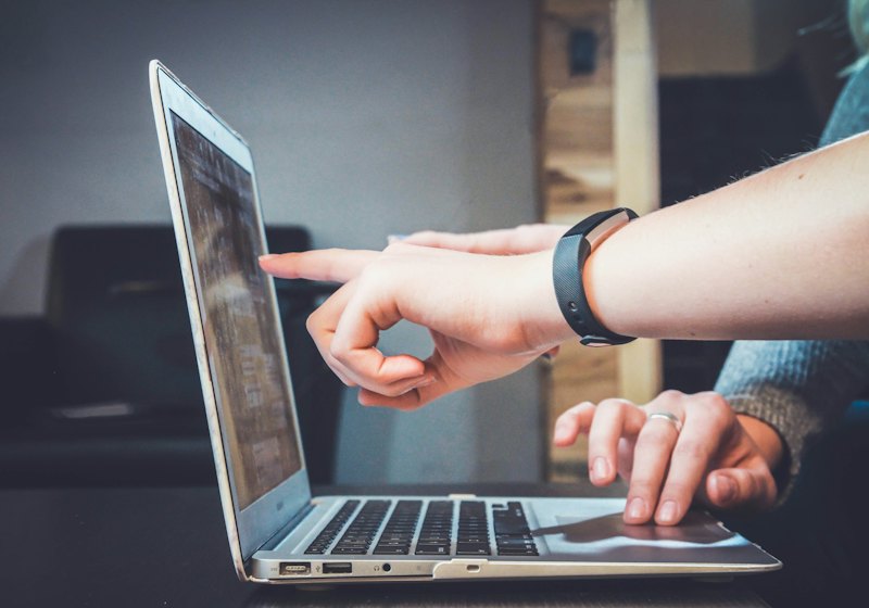 Person on a laptop joining an online consultation